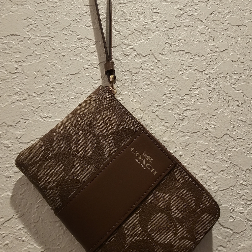 Women's  N.W.T.S. Brown  small  Carriage clutch with strap